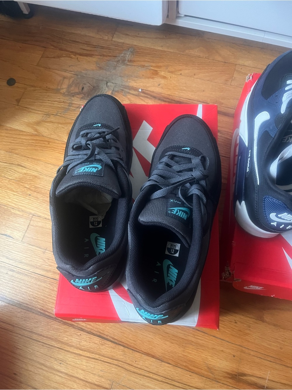 Nike Men’s Black Sneakers with Teal Accents